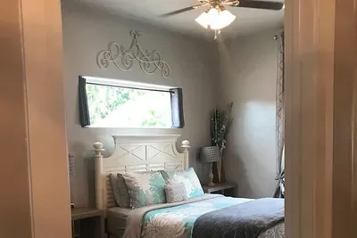 Large bedroom, queen size bed, walk in closet.
