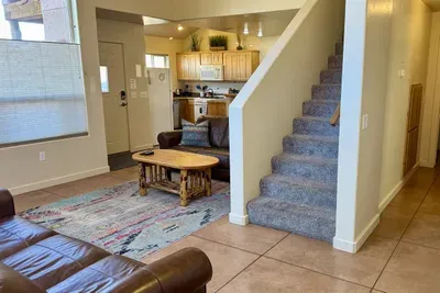 Hallway to the right of the stairs leads to the master suite