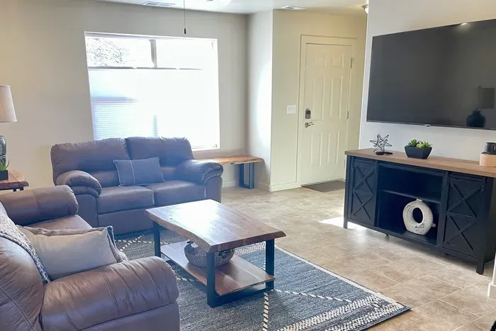 Comfortable Living Area with 65" Smart TV