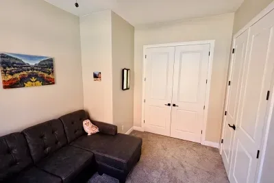 Flex Room with desk and sleeper sofa located just off the living room