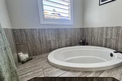 Enjoy the soothing warmth from this deep tub