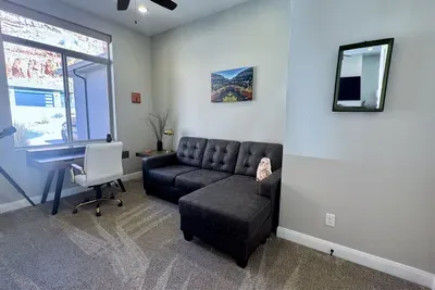 Flex Room with desk and sleeper sofa located just off the living room