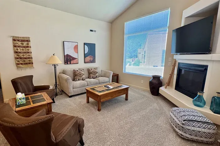 Comfortable Living Room with Smart TV & Fireplace