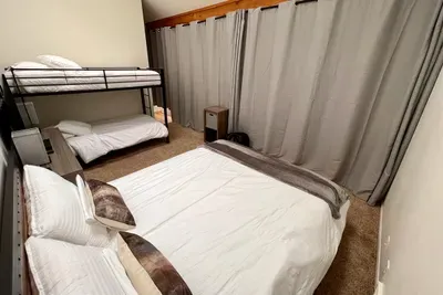 Loft with queen bed and twin bunks