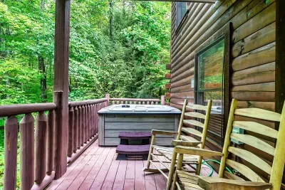 Lower Deck with hot tub, grill and sitting area