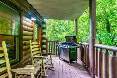 Lower deck with grill and sitting area enjoying quiet serene nature view