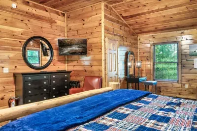 Large cozy master bedroom with Jacuzzi and en suite bathroom. 