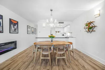 6 Chair Dinning Table with Beautiful Chandelier and Fireplace