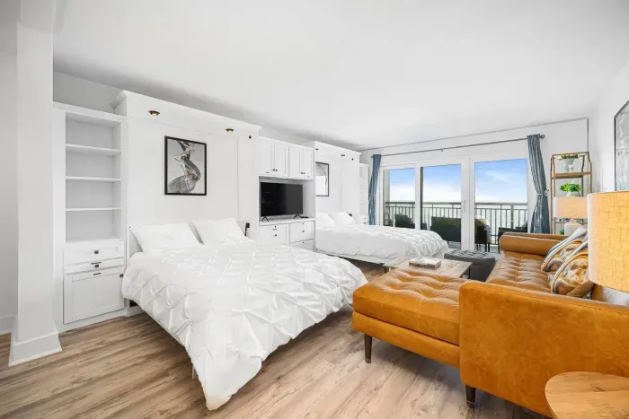 Two Queen Size Murphy Beds.  They are folded against the wall when not being used.  Lisen to the sound of the waves!