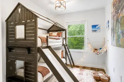 Bedroom #4.  Kids Bedroom on 3rd Floor with twin bunk bed, Arcade game, stuffed animal toys, floor cushions