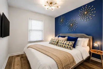 Bedroom #3 on 3rd Floor with King size bed, dimmer table lamps and 40” smart TV