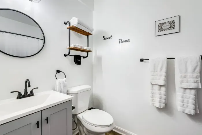 Bathroom #1 (First Floor).  Full Bath.  10'' Showerhead and Handled Showerhead Combo.  Bathtub.  Towels.  Shampoo. Conditioner. Body Soap. Cotton Balls.  Q-Tips.  Hand Soap. Hair Dryer.