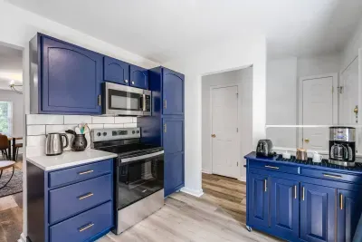 Fully stocked kitchen with cookingware set, silverware, blender, plastic wrap, baking basics, salt, cooking oil, piper, knifes, cutting boards, electronic kettle, coffee maker, toaster, coffee, sugar, coffee mate, Brita water filter, wine glasses.