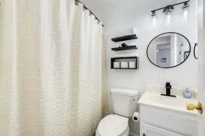 Bathroom #4 ( 3rd Floor).  Full Bath.  Shower and Bathtub Combo.  Towels.  Shampoo. Conditioner. Body Soap.  Hand Soap.  Hair Dryer.