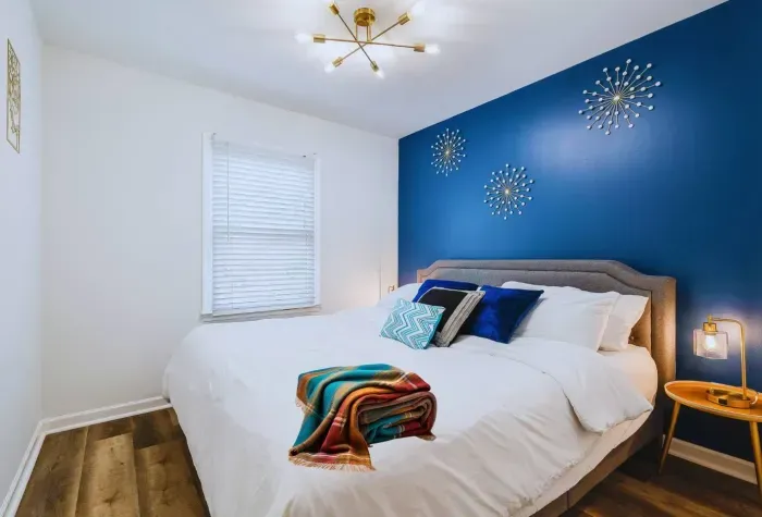 Bedroom #3 on 3rd Floor with King size bed, dimmer table lamps and 40” smart TV