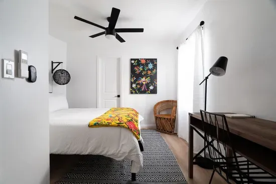 Located on the first floor, has a queen bed, and can access the bottom floor bathroom from the room. This is the only bedroom located downstairs.