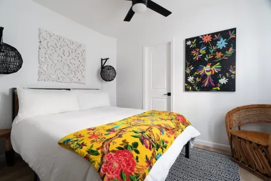 Located on the first floor, has a queen bed, and can access the bottom floor bathroom from the room. This is the only bedroom located downstairs.