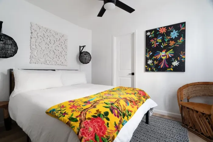 Located on the first floor, has a queen bed, and can access the bottom floor bathroom from the room. This is the only bedroom located downstairs.