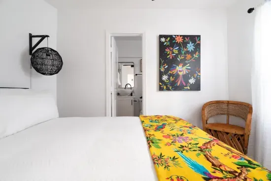 Located on the first floor, has a queen bed, and can access the bottom floor bathroom from the room. This is the only bedroom located downstairs.