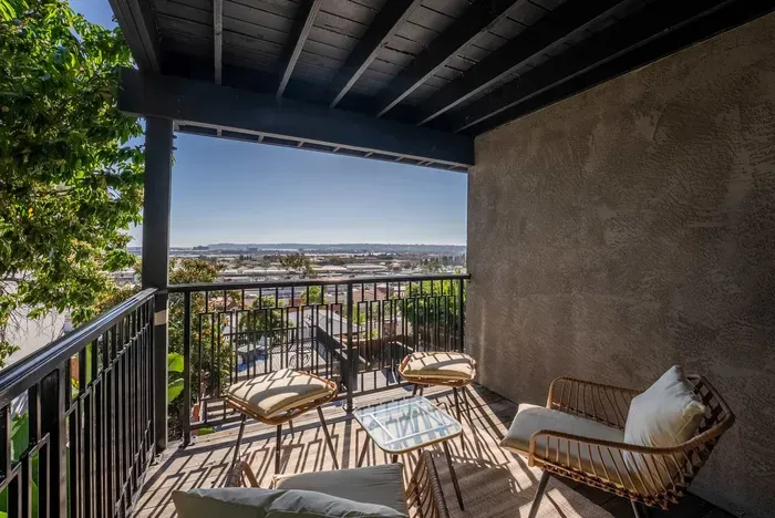 Downstairs bedroom private balcony with city views