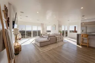 Living areas, sectional couch, smart tv, 180 panoramic views of San Diego.