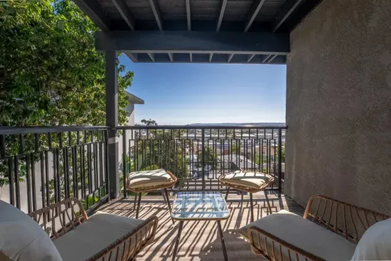 Downstairs bedroom private balcony with city views