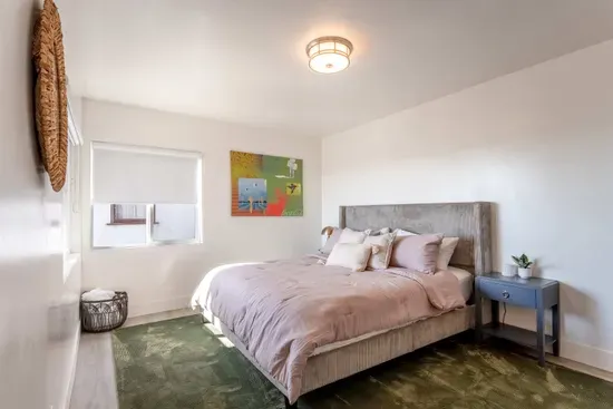 downstairs primary bedroom - King Bed, TV,  Private full Bath and Balcony. Walk In Closet.