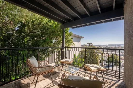 Downstairs bedroom private balcony with city views