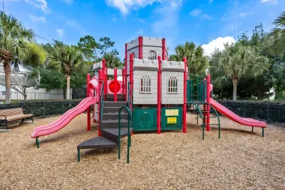 Family-friendly playground with castle theme, slides, and sunny outdoor space