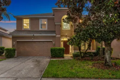 Welcoming two-story home with glowing entry and great curb appeal