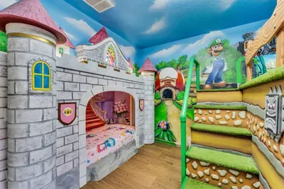 Mario-Themed Room: A stone castle turret hides a cozy bunk nook, with Luigi keeping watch over the green pipe stairway!