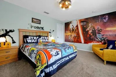Envision a bedroom that transports you to the enchanting world of Star Wars, complete with a luxurious queen-sized bed.
