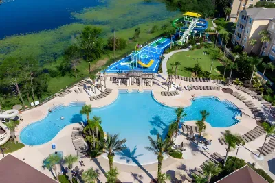 Resort waterpark with pool and waterslides, overlooking the lake