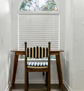 Charming window-side workspace with warm wood finishes and natural light