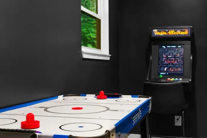 Fun-filled game room with air hockey and classic arcade entertainment