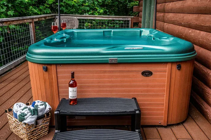 Private deck hot tub with wooded views for a relaxing soak