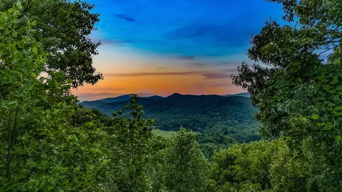 Breathtaking sunset mountain views in a peaceful, wooded setting