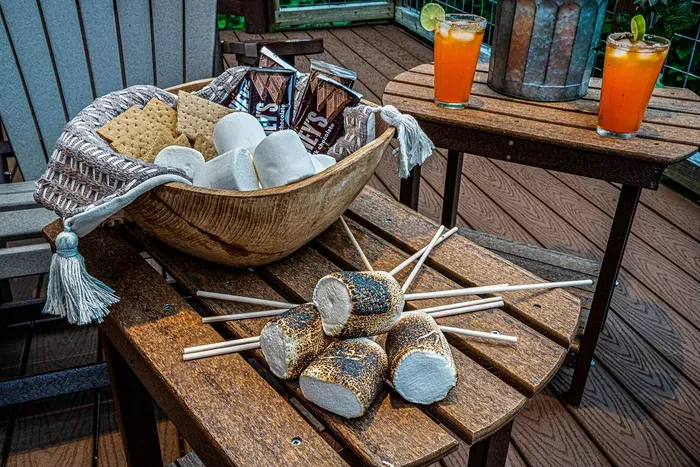 Cozy deck setup with cocktails and s’mores for the perfect evening