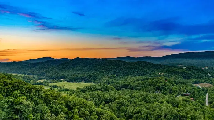 Panoramic mountain views framed by a stunning sunset sky