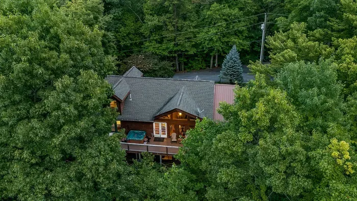 Secluded woodland cabin with a hot tub deck and cozy lodge charm
