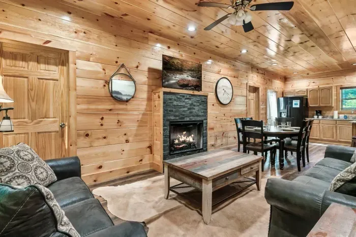 First floor fireplace, seating area, and dining table 