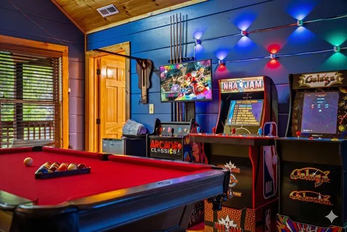 Fiddle hook game, mini fridge, pool table and three more arcades. 8 total!