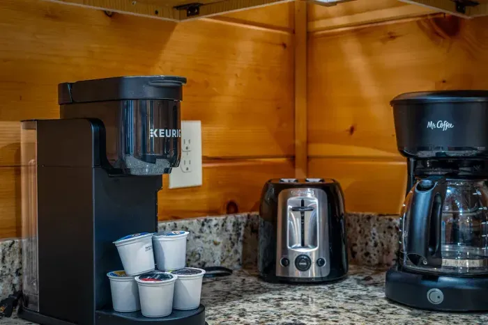 Coffee lovers’ nook: Keurig + drip brewer, pods and toaster.
