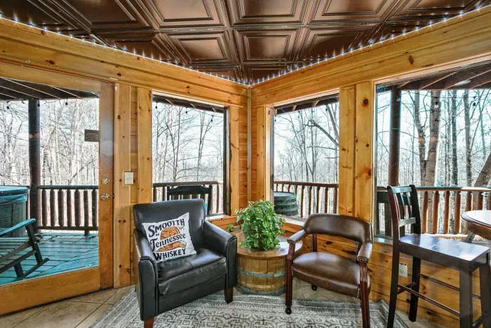 Lounge seating near outdoor deck with hot tub and seating 