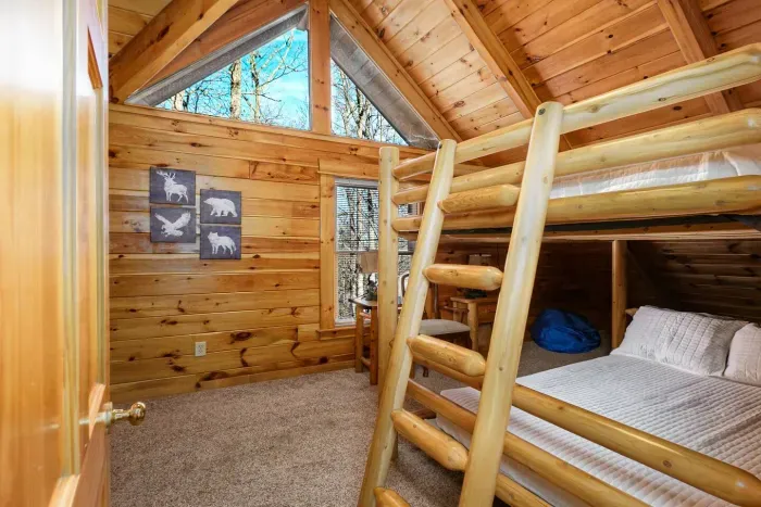 Upstairs bedroom with bunk beds and streaming TV