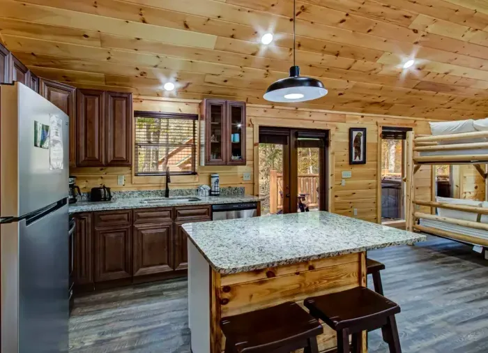 Open kitchen with granite counters and stainless steel appliances 