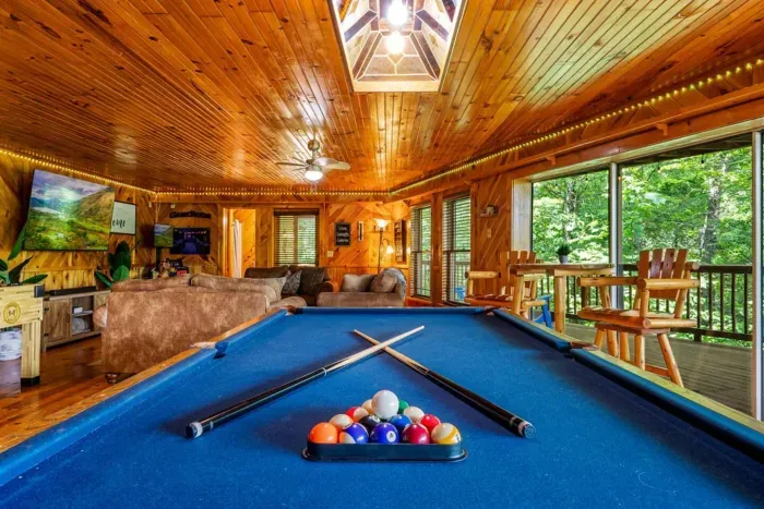 Full size billiard table with wall to ceiling windows and private deck access 