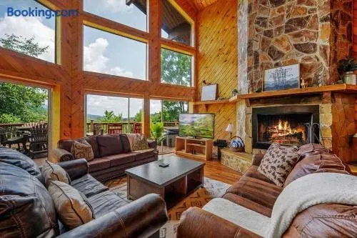 Stacked stone fireplace with large living upstairs area