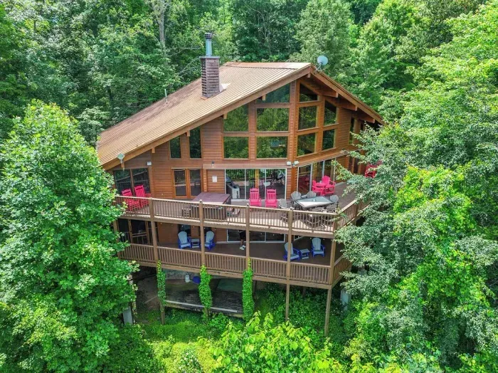 Both decks furnished with adirondeck chairs and tables to enjoy the views