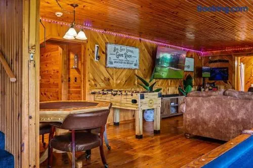 Poker table, foosball, and second kitchen with guest bathroom on the same level